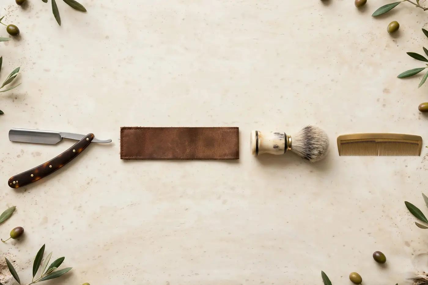 Barber tools lined up with inspection precision: straight razor, strop, brush, comb